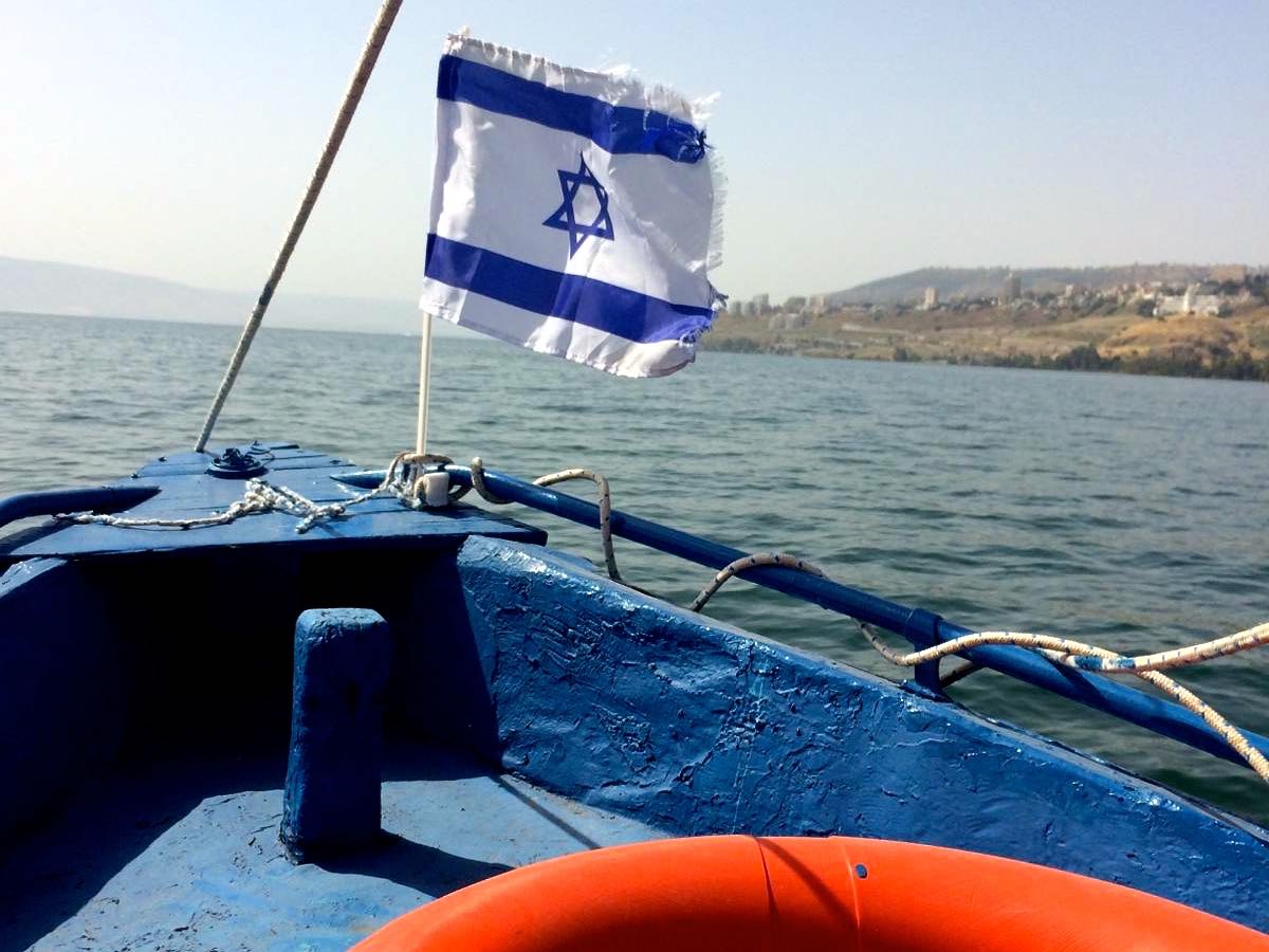 Pivture of the stern of a boat with an Israeli flag
